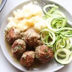 Plated Swedish Meatballs with a side of zucchini noodles.