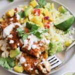 Blackened flounder, plated on a small gray dish and served with cauliflower rice, pineapple salsa, and chili-lime drizzle.