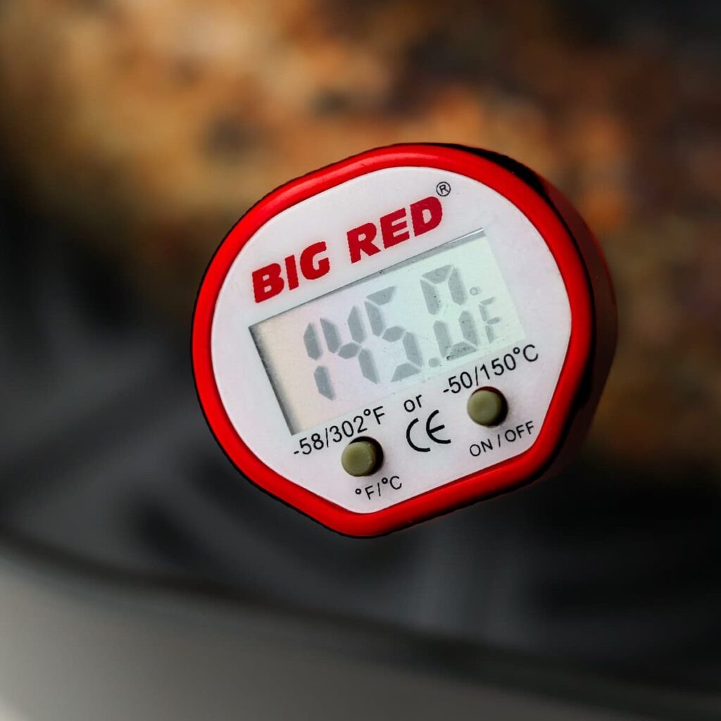 Meat thermometer registering 145°F.