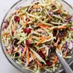 Top down of a glass bowl filled with mixed Broccoli Ranch Slaw
