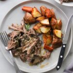 Plated lamb shoulder and roasted vegetables.