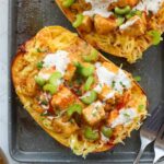 Close up of one buffalo chicken stuffed spaghetti squash boat.