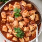 Crock pot sweet Hawaiian chicken in a large serving bowl, viewed from above.