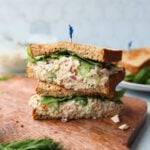 Greek yogurt tuna salad served on a sandwich, cut in half and stacked.