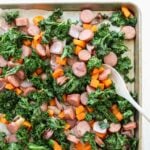 Chicken sausage and vegetables on a sheet pan.