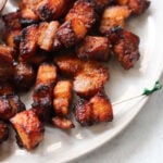 Plated honey bbq pork belly bites.