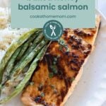 A plate of baked honey balsamic salmon with grilled green beans and rice, subtly echoing the flavors of a pork chop marinade, garnished with herbs.