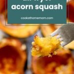 Close-up of a fork holding cooked acorn squash with blurred squash halves in the background, reminiscent of the savory delight in baked clams oreganata. Text reads "air fryer acorn squash cookathomemom.com.