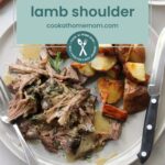 Plate with slow-cooked lamb shoulder, roasted potatoes, and herbs. A knife rests beside the dish. Text overlay reads: "Slow cooked lamb shoulder cookathomemom.com". Perfect for those who enjoy a ranch chicken twist with their hearty meals.