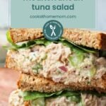 Two stacked Mediterranean tuna salad sandwiches with lettuce on whole grain bread, shown close up. Text overlay reads "Mediterranean tuna salad" with a website link.