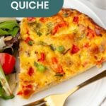 A slice of crustless quiche with vegetables, served on a white plate alongside a fresh side salad and a gold fork.