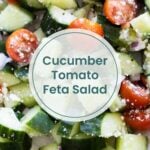 Close-up of a fresh cucumber tomato feta salad with diced red onions. Text overlay reads: “Cucumber Tomato Feta Salad.”.