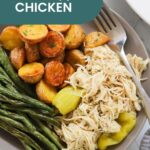 A plate with shredded Mississippi chicken, cooked green beans, roasted potatoes, and yellow pepper slices, labeled "Mississippi Chicken," sits beside oven baked salmon in foil for a delicious and balanced meal.