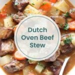 Bowl of Dutch oven beef stew with chunks of beef, potatoes, carrots, and herbs in a thick broth, shown with a spoon. Perfect for cozy nights, just like brats in oven. Text overlay reads "Dutch Oven Beef Stew.