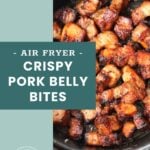 Crispy pork belly bites cooked in an air fryer, shown browned and piled inside the air fryer basket, with a text overlay describing the dish.