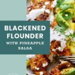 A plate of blackened flounder topped with creamy sauce, pineapple salsa, cilantro, and avocado slices, with a fork resting on the plate.