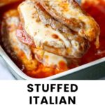 A fork holds a stuffed Italian sausage topped with melted cheese and sauce, with more sausages in a baking dish in the background.